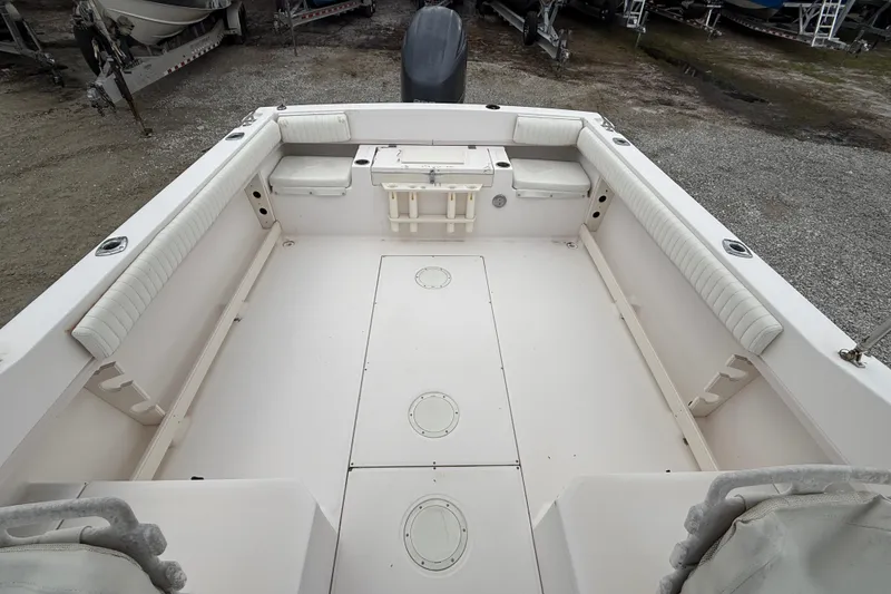 Slide: The Image of 2000 Grady-White Freedom 225 boat interior with spacious seating and storage. - 9