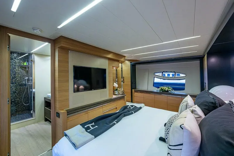 Slide: The Image of Luxurious interior of 2014 Pershing 92 yacht with modern bedroom and ensuite bathroom. - 15