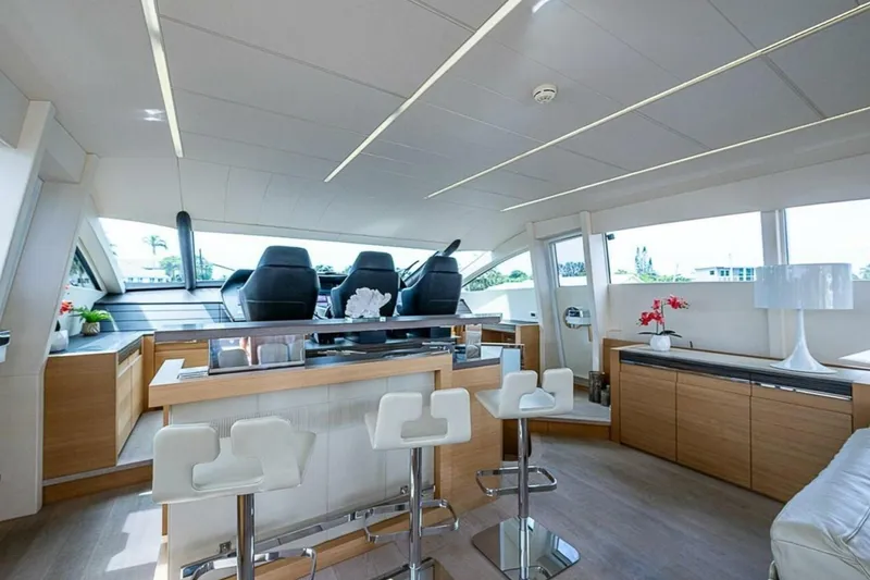 Slide: The Image of Luxurious interior of a 2014 Pershing 92 yacht with modern seating and elegant decor. - 24