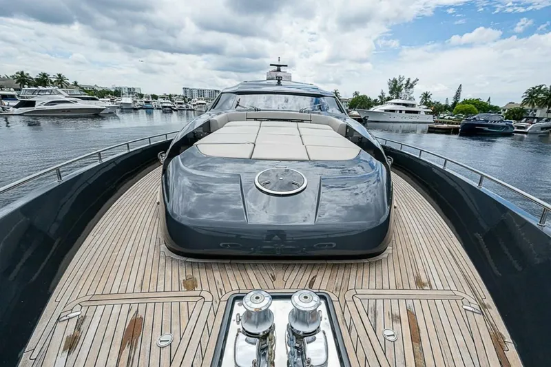 Slide: The Image of Luxury 2014 Pershing 92 yacht with sleek design and spacious deck in marina setting. - 27