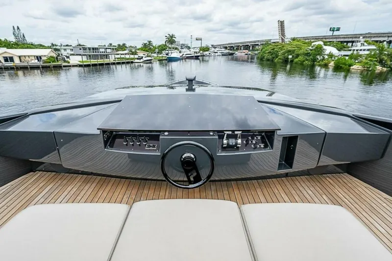 Slide: The Image of 2014 Pershing 92 yacht helm with sleek design and waterfront view. - 31