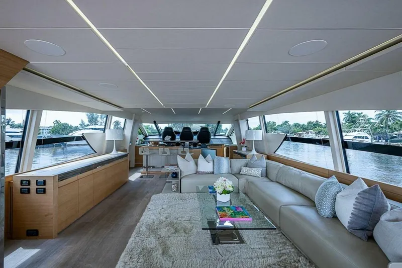 Slide: The Image of Luxurious interior of a 2014 Pershing 92 yacht with modern decor and panoramic windows. - 9