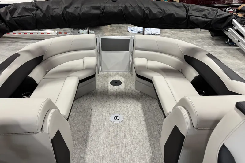 Slide: The Image of 2026 Berkshire 24RFX LE pontoon boat interior with plush seating and modern design. - 10