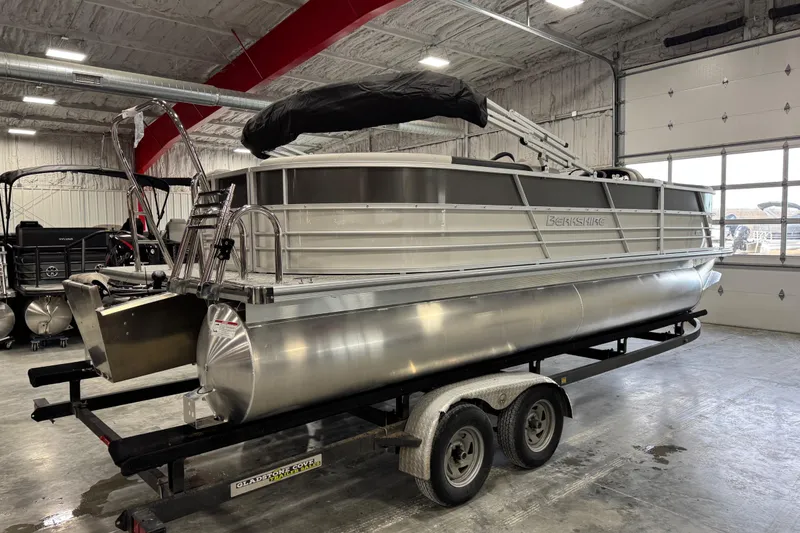 Slide: The Image of 2026 Berkshire 24RFX LE pontoon boat on trailer in indoor showroom. - 4