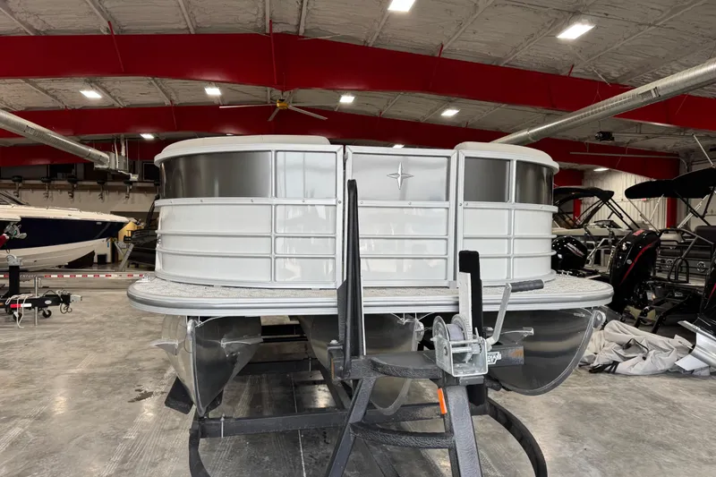 Slide: The Image of 2026 Berkshire 24RFX LE pontoon boat in a showroom, front view. - 5