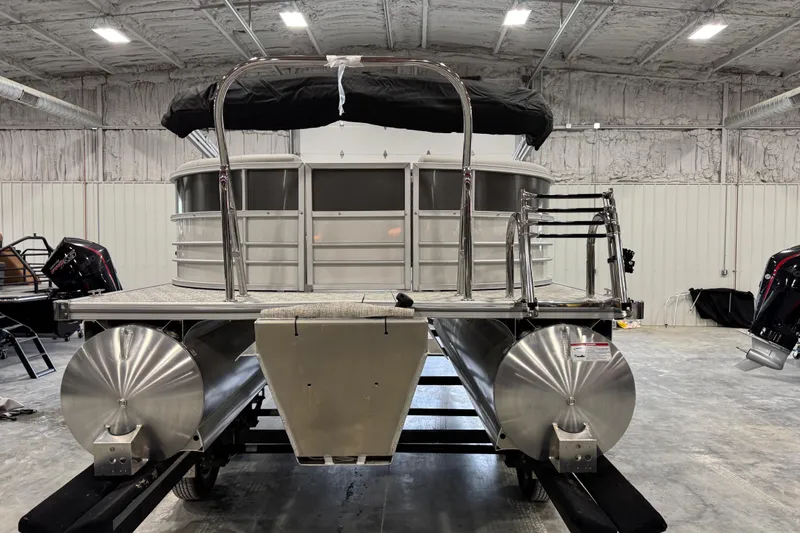 Slide: The Image of 2026 Berkshire 24RFX LE pontoon boat in a warehouse setting. - 6