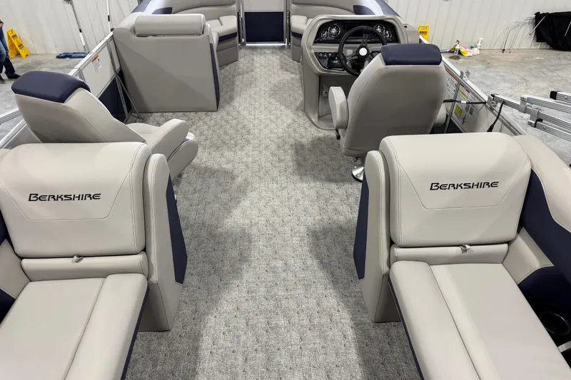Slide: The Image of 2026 Berkshire 24RFX LE pontoon boat interior with luxurious seating and modern design. - 6