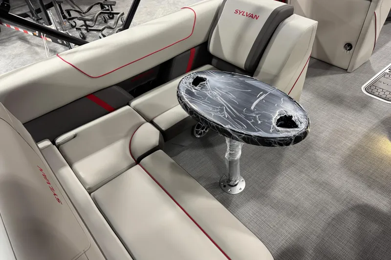 Slide: The Image of Luxurious Sylvan X-5 2026 boat interior with plush seating and sleek table design. - 10