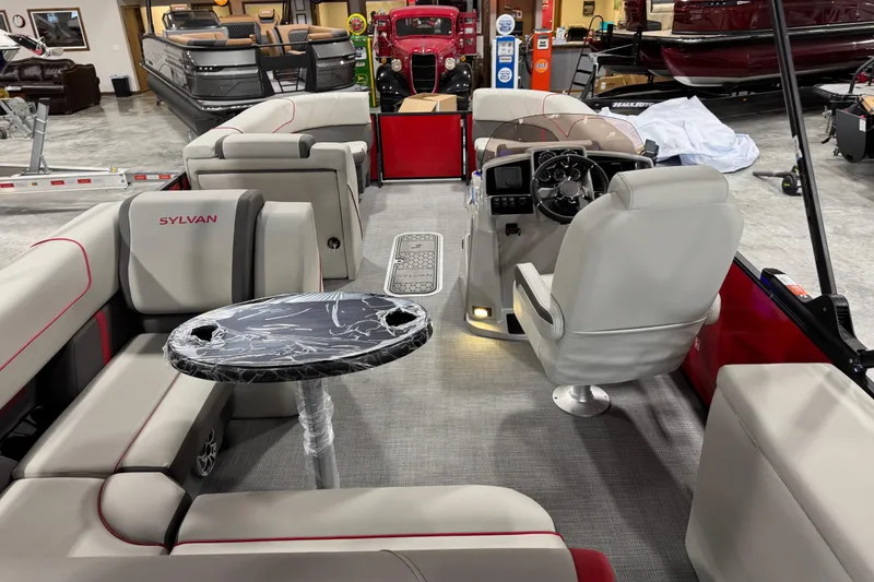 Slide: The Image of Luxurious 2026 Sylvan X-5 boat interior with plush seating and modern dashboard. - 11
