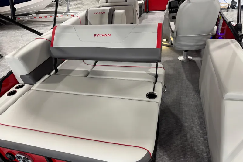 Slide: The Image of Interior of 2026 Sylvan X-5 boat with gray and red seating, cup holders, and steering console. - 12