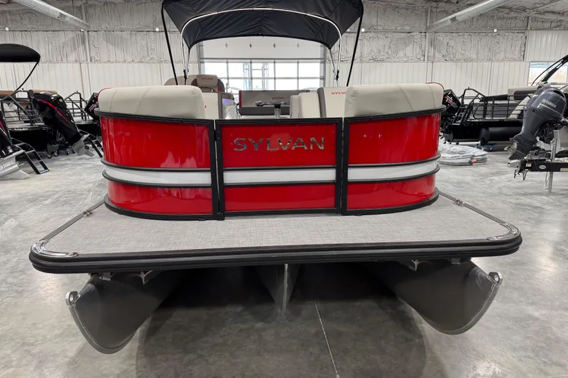 Slide: The Image of 2026 Sylvan X-5 pontoon boat, red exterior, displayed in a showroom. - 5