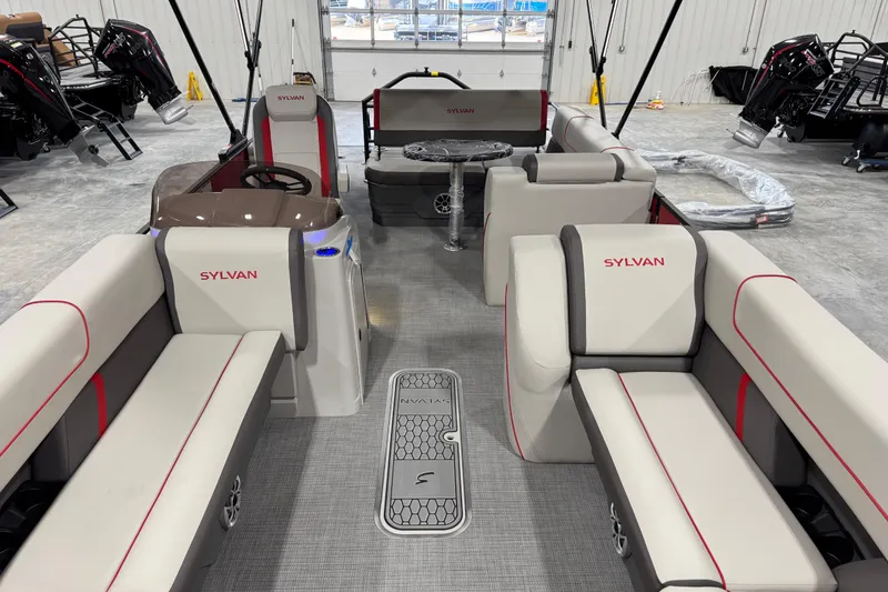 Slide: The Image of Interior of 2026 Sylvan X-5 boat with modern seating and steering console. - 6