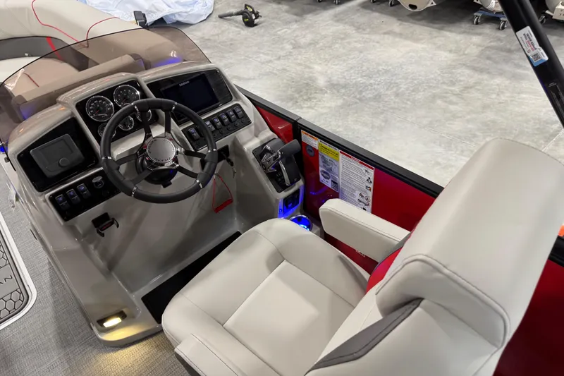 Slide: The Image of Interior view of 2026 Sylvan X-5 boat cockpit with modern controls and steering wheel. - 7