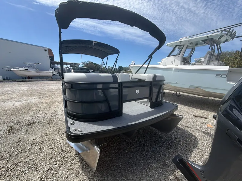 Slide: The Image of 2026 Sweetwater 2286 FS pontoon boat on gravel lot. - 10
