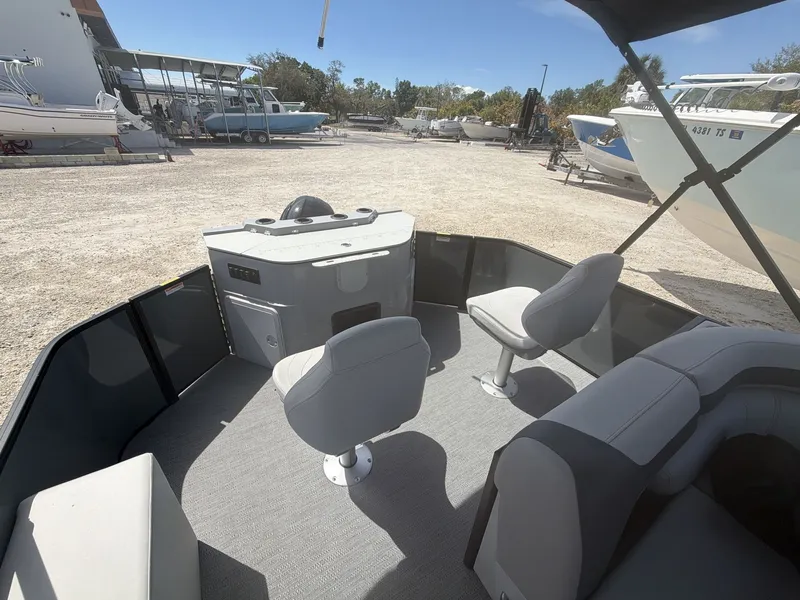 Slide: The Image of Interior of Sweetwater 2286 FS boat, 2026 model, featuring seating area. - 11
