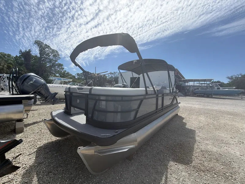 Slide: The Image of Sweetwater 2286 FS pontoon boat 2026 on gravel lot. - 12