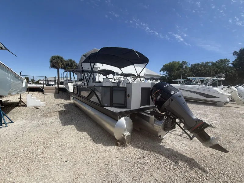 Slide: The Image of 2026 Sweetwater 2286 FS pontoon boat on gravel lot. - 13