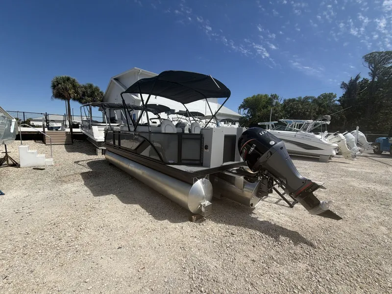 Slide: The Image of 2026 Sweetwater 2286 FS pontoon boat on gravel lot. - 7