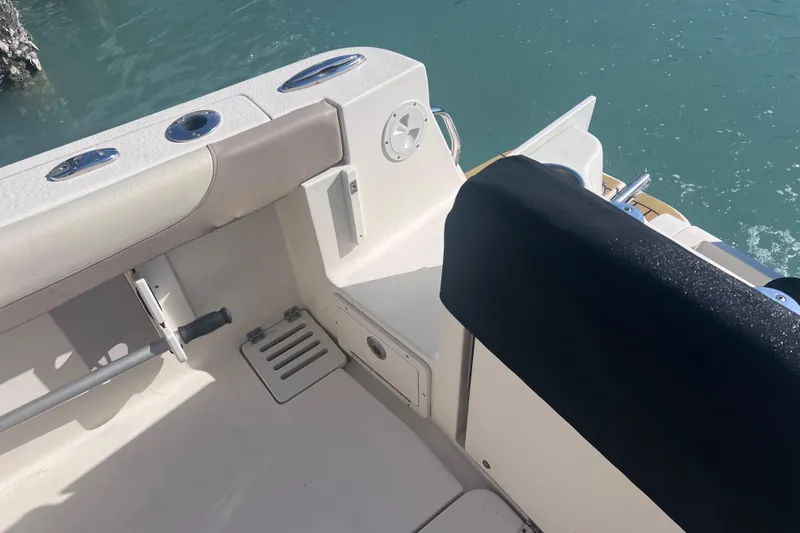 Slide: The Image of 2015 Scout 255 LXF boat interior with seating and water view. - 23