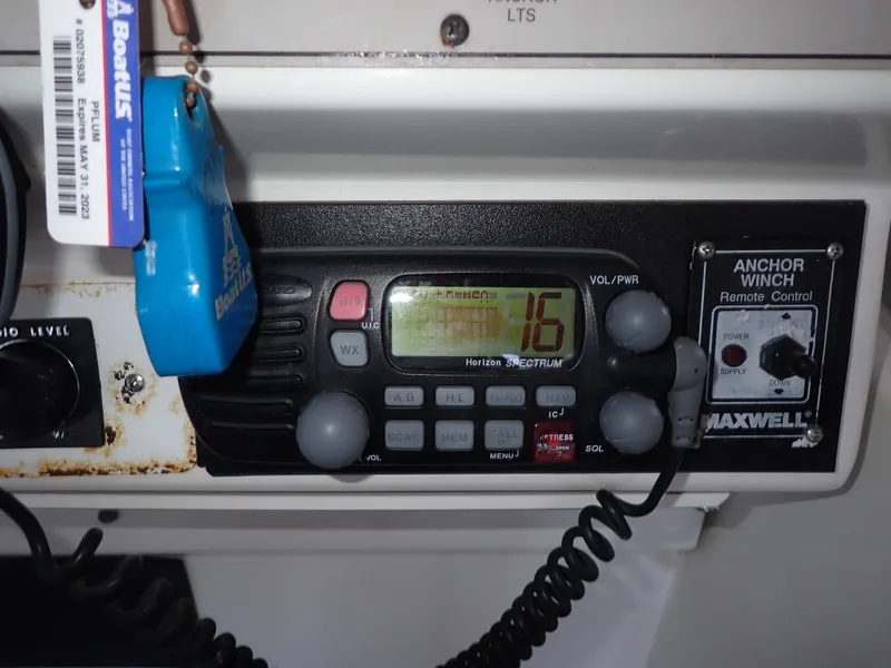 Slide: The Image of 1996 Carver 370 Voyager control panel with radio and anchor winch remote. - 27