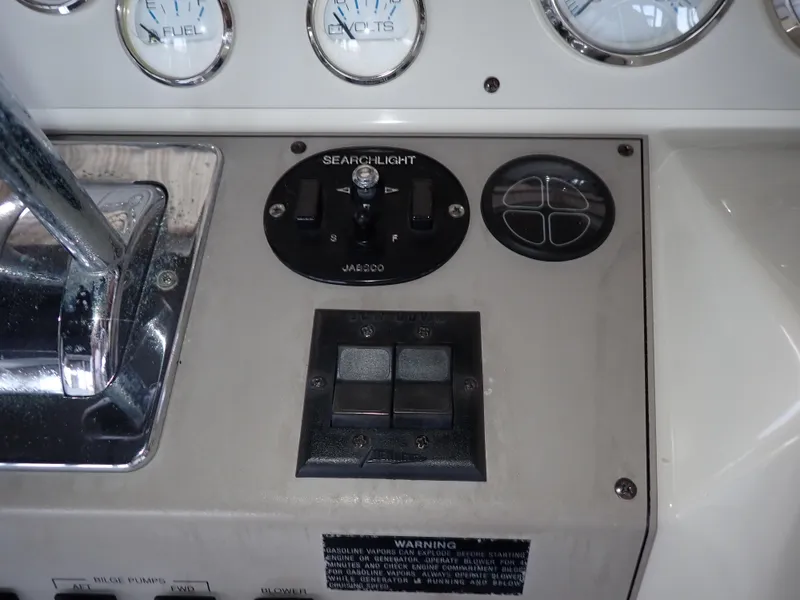 Slide: The Image of Control panel of a 1996 Carver 370 Voyager boat with searchlight and gauges. - 28