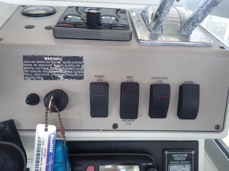 Slide: The Image of Control panel of a 1996 Carver 370 Voyager boat with labeled switches and warning label. - 30