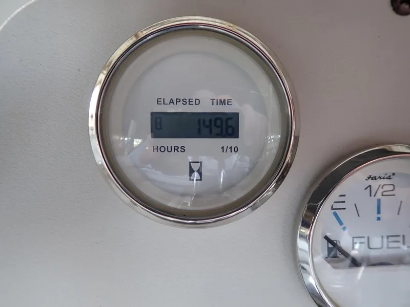 Slide: The Image of Elapsed time gauge on 1996 Carver 370 Voyager, showing 1496 hours. - 31