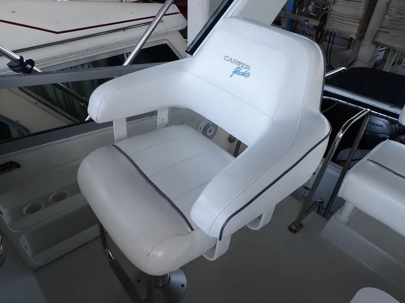Slide: The Image of White captain's chair on 1996 Carver 370 Voyager yacht, featuring sleek design and comfortable seating. - 34