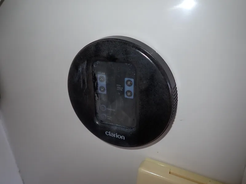 Slide: The Image of Control panel on a 1996 Carver 370 Voyager boat, featuring a Clarion interface. - 45