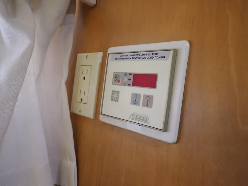 Slide: The Image of 1996 Carver 370 Voyager control panel and outlet. - 12