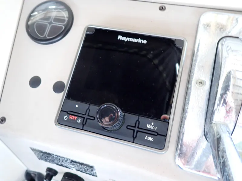 Slide: The Image of Raymarine navigation system on 1996 Carver 370 Voyager boat dashboard. - 26