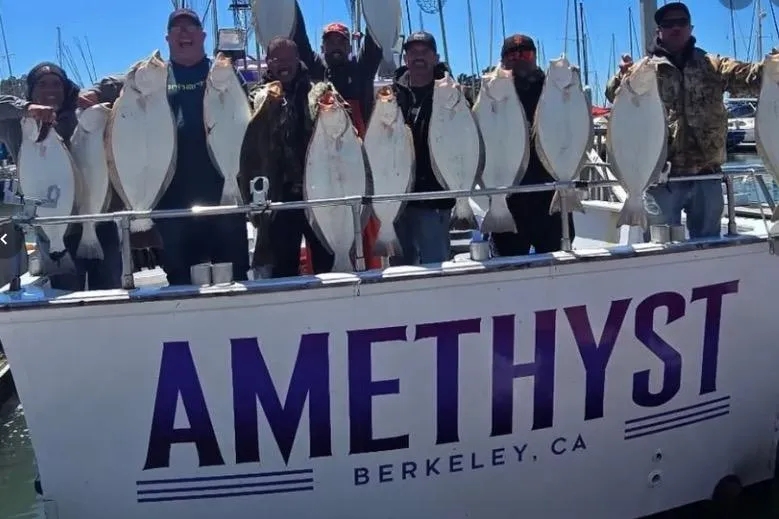 Slide: The Image of Group holding fish on 1978 Uniflite 50 boat "Amethyst" in Berkeley, CA marina. - 3