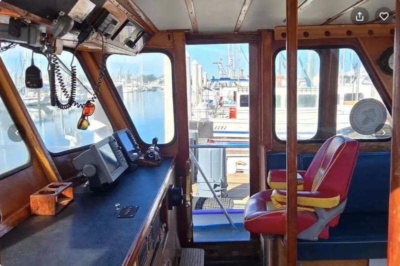 Slide: The Image of 1978 Uniflite 50 boat interior with control panel and red captain's chair. - 6
