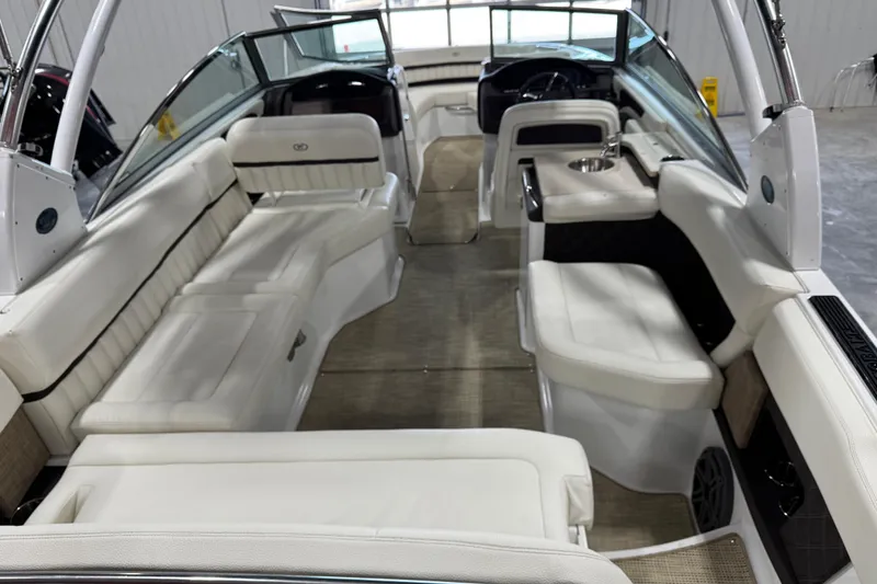 Slide: The Image of 2017 Cobalt A28 boat interior with luxurious white seating and modern design. - 10