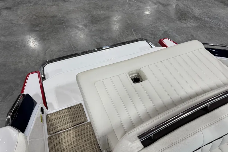 Slide: The Image of 2017 Cobalt A28 boat interior with white seating and sleek design. - 12