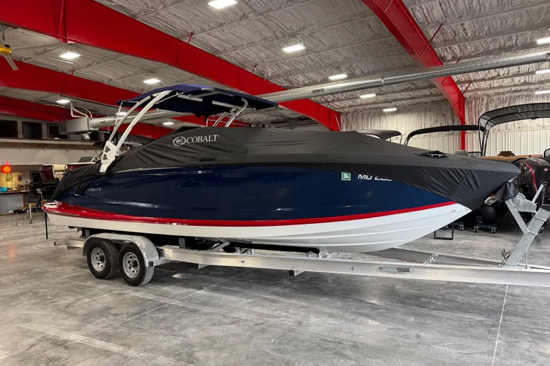 Slide: The Image of 2017 Cobalt A28 boat on trailer in indoor storage facility. - 17