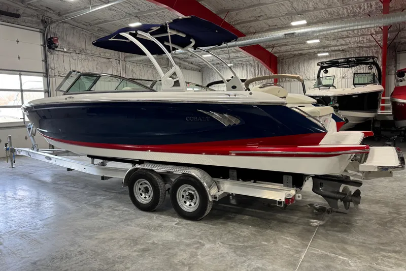 Slide: The Image of 2017 Cobalt A28 boat on trailer in indoor showroom setting. - 4