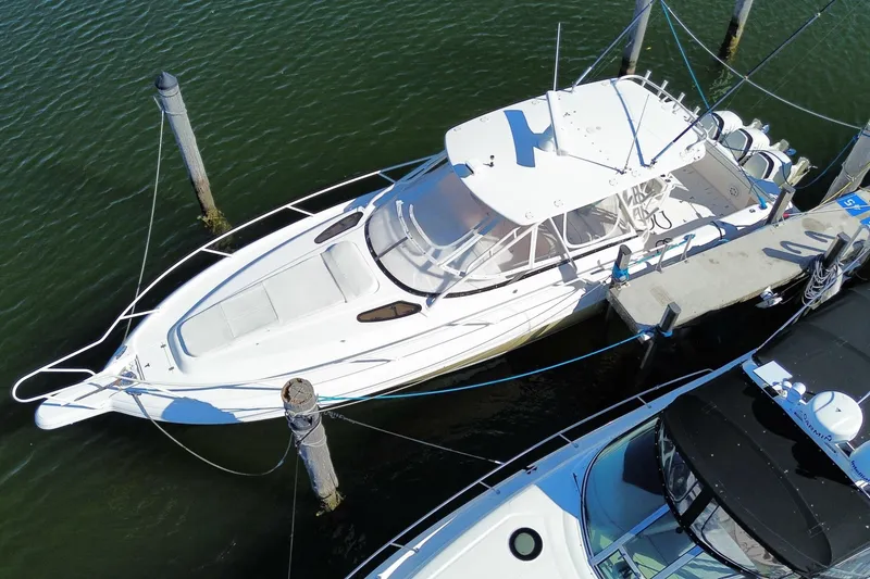 Slide: The Image of 2001 Intrepid 377 Walkaround boat docked in marina, aerial view. - 11
