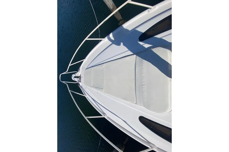 Slide: The Image of Bow view of 2001 Intrepid 377 Walkaround boat on water. - 14