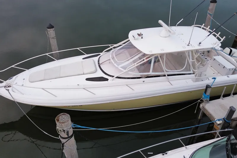 Slide: The Image of 2001 Intrepid 377 Walkaround boat docked at marina, aerial view. - 2