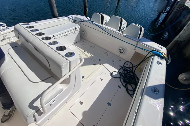 Slide: The Image of 2001 Intrepid 377 Walkaround boat interior with seating and cup holders. - 20