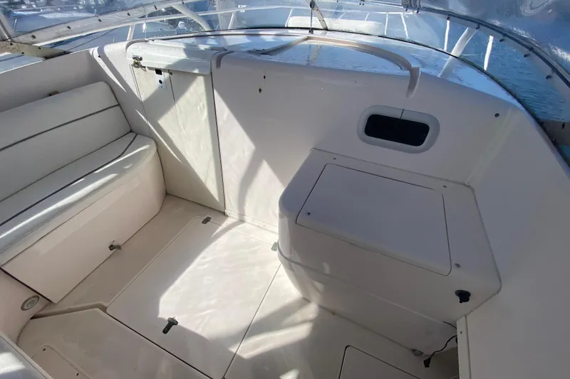 Slide: The Image of 2001 Intrepid 377 Walkaround boat interior with seating and storage compartments. - 35