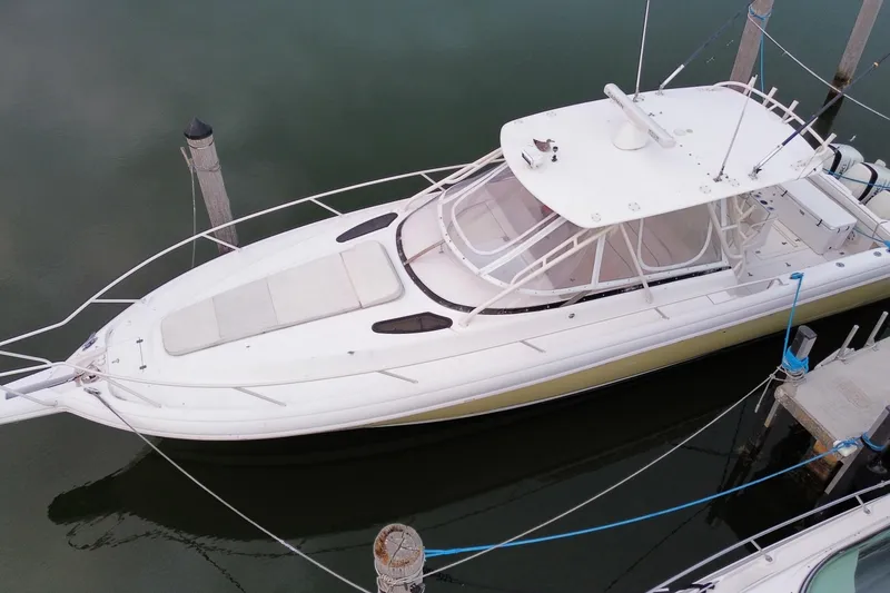 Slide: The Image of 2001 Intrepid 377 Walkaround boat docked in calm waters, aerial view. - 4