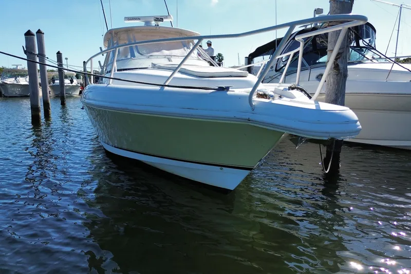 Slide: The Image of 2001 Intrepid 377 Walkaround boat docked in marina, front view. - 5