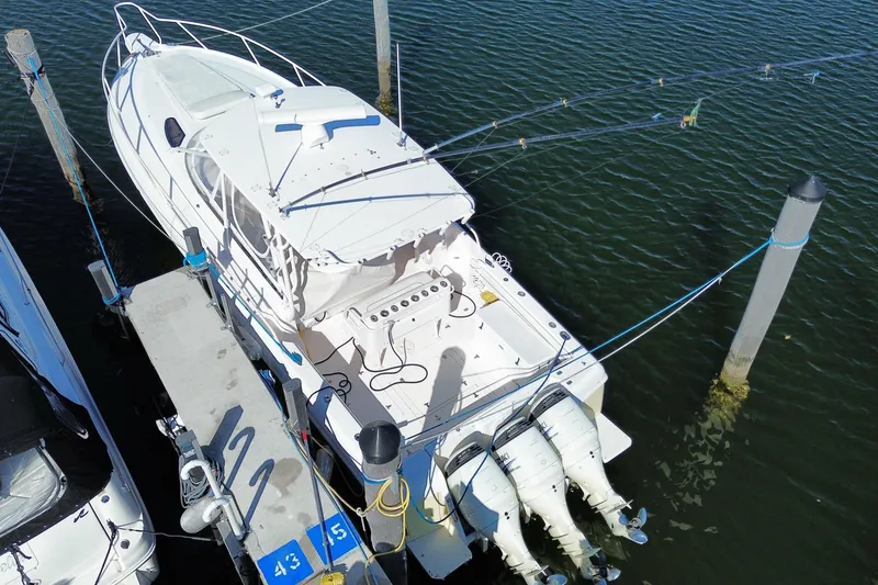 Slide: The Image of Aerial view of a 2001 Intrepid 377 Walkaround boat docked at a marina. - 52