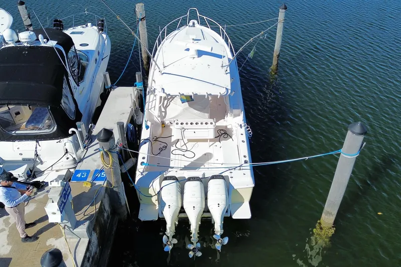 Slide: The Image of Aerial view of a 2001 Intrepid 377 Walkaround boat docked at a marina. - 53
