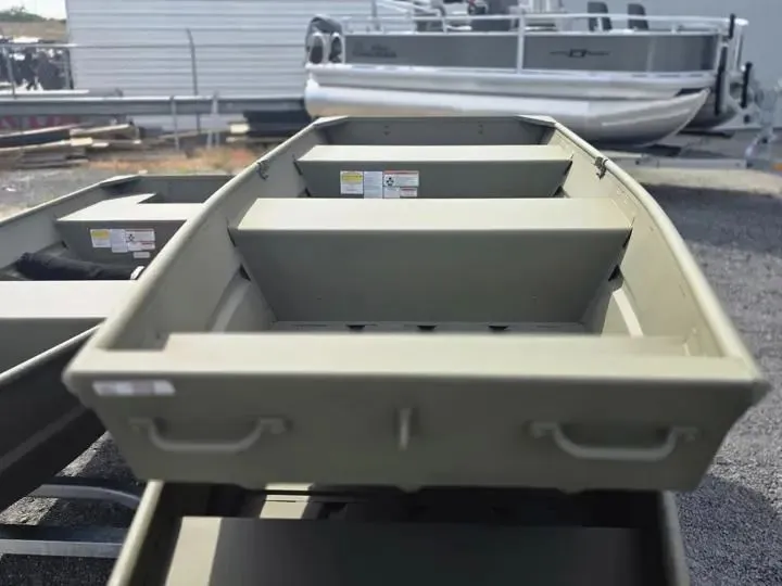 Slide: The Image of 2026 Tracker Grizzly 12 Jon boat in a parking lot. - 5