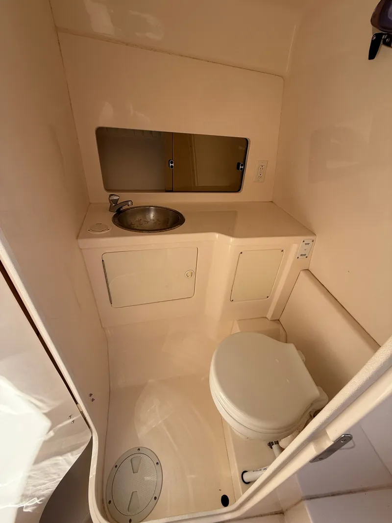 Slide: The Image of Compact bathroom in a 2000 Intrepid 356 boat. - 17