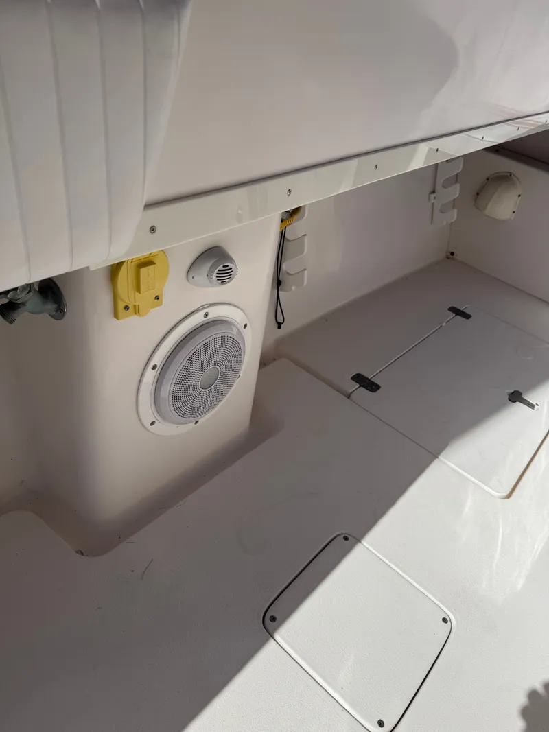 Slide: The Image of Interior of a 2000 Intrepid 356 boat with speaker and storage. - 21