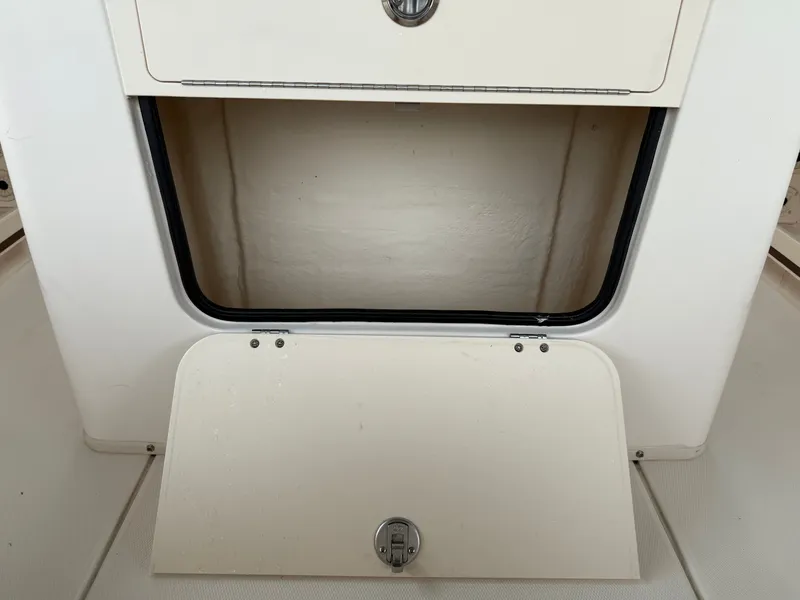 Slide: The Image of Intrepid 356 boat compartment door open, year 2000. - 29